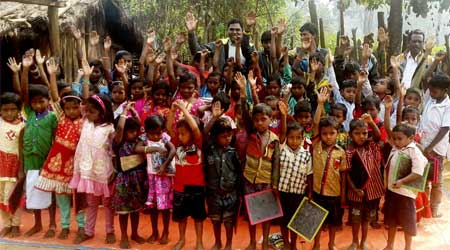 Children holding slates after classes